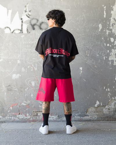 Schwarzes T-Shirt Rotes Arch-Logo